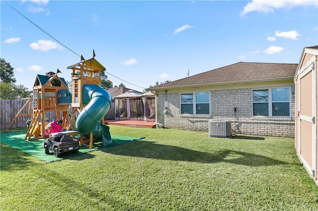 view of play area featuring a yard and central air condition unit