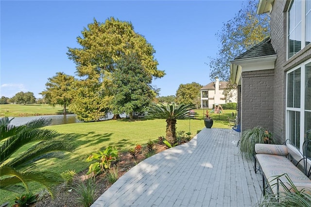 exterior space with a yard and a water view