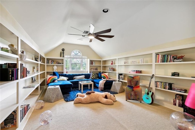 recreation room featuring carpet floors, ceiling fan, and vaulted ceiling