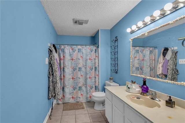 bathroom featuring a textured ceiling, toilet, vanity, a shower with shower curtain, and tile patterned flooring