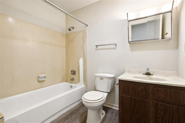 full bathroom with bathing tub / shower combination, hardwood / wood-style floors, vanity, and toilet