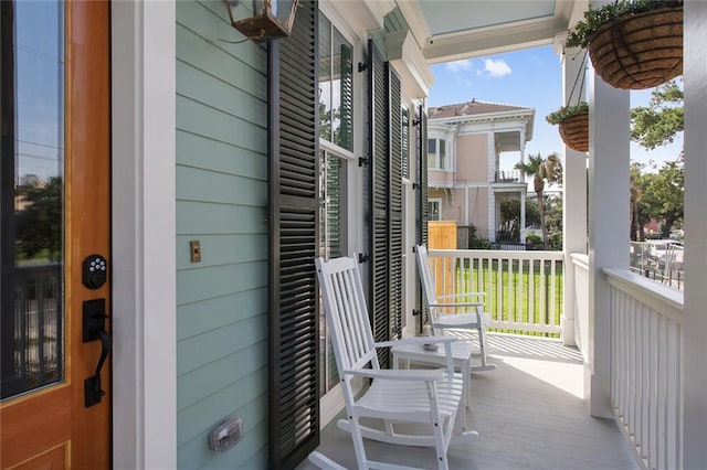 balcony featuring covered porch