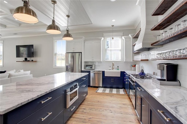 1417-1419 Esplanade Ave, New Orleans, LA 70116 - kitchen featuring appliances with stainless steel finishes, blue cabinets, open shelves, open floor plan, and light wood-style flooring