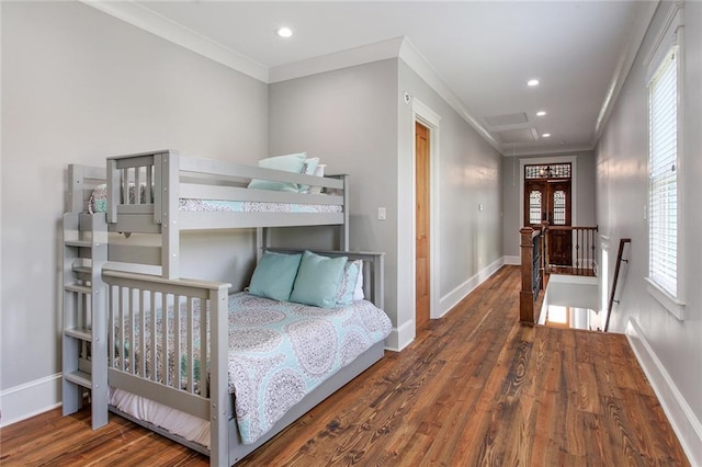 bedroom featuring dark hardwood / wood-style flooring and ornamental molding