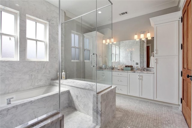 bathroom featuring vanity, independent shower and bath, and crown molding