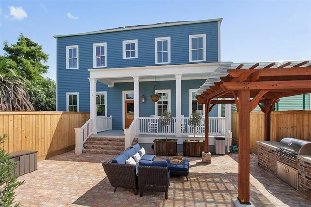 1417-1419 Esplanade Ave, New Orleans, LA 70116 - rear view of house with an outdoor kitchen, a fenced backyard, outdoor lounge area, a porch, and a patio area
