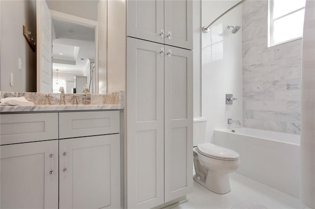 full bathroom with tiled shower / bath combo, vanity, and toilet