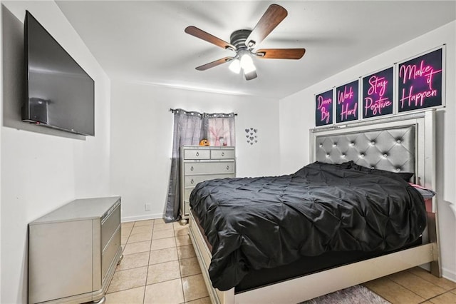 tiled bedroom with ceiling fan