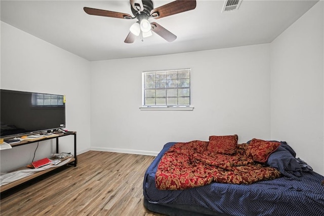 bedroom featuring ceiling fan and hardwood / wood-style flooring