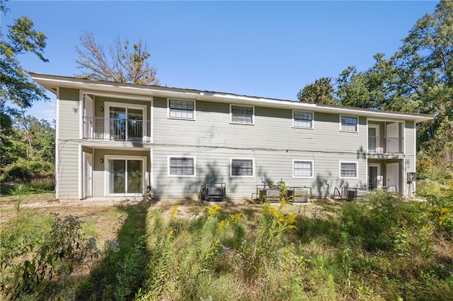 back of house featuring a balcony