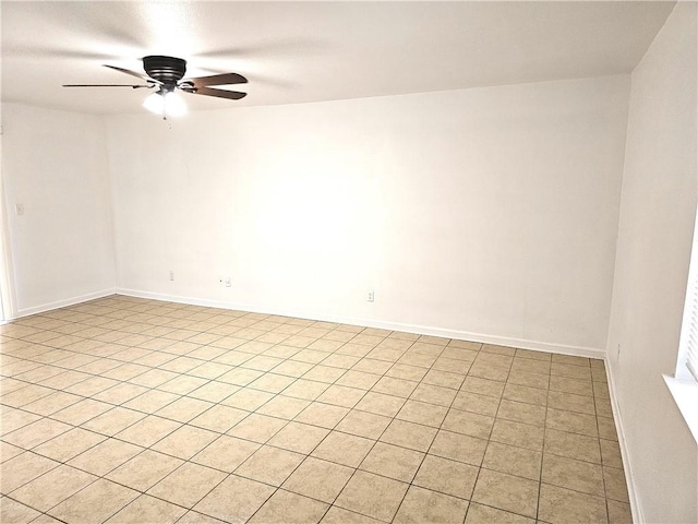 unfurnished room with light tile patterned floors and ceiling fan