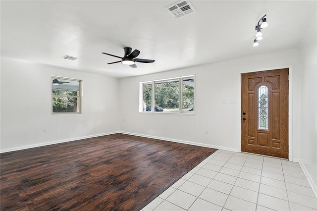 entryway with light hardwood / wood-style floors and ceiling fan