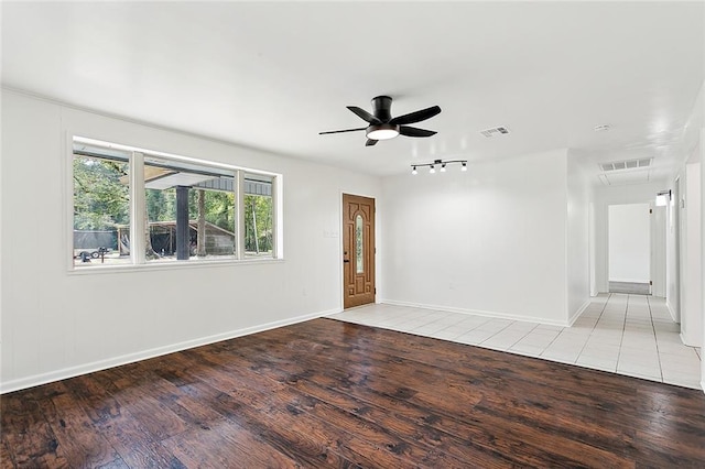 spare room featuring ceiling fan and light wood-type flooring