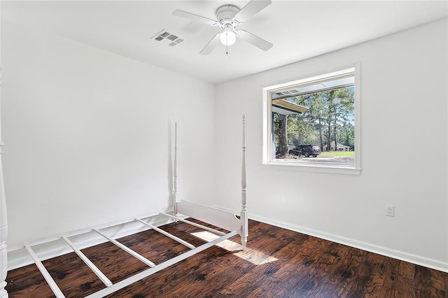 spare room with hardwood / wood-style flooring and ceiling fan