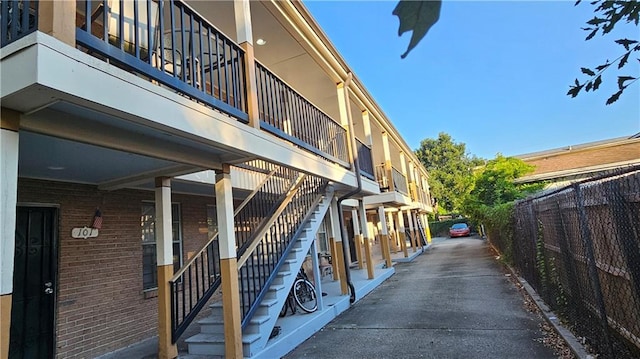 1114 N Dorgenois St, New Orleans, LA 70119 - view of property with stairway and fence