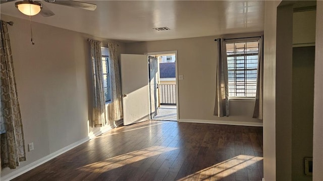 1114 N Dorgenois St, New Orleans, LA 70119 - spare room with baseboards, a healthy amount of sunlight, a ceiling fan, and hardwood / wood-style flooring