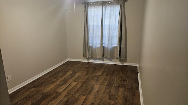 1114 N Dorgenois St, New Orleans, LA 70119 - spare room with baseboards and dark wood-type flooring