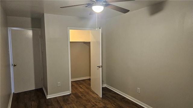 1114 N Dorgenois St, New Orleans, LA 70119 - unfurnished bedroom with wood finished floors, a closet, a walk in closet, ceiling fan, and baseboards