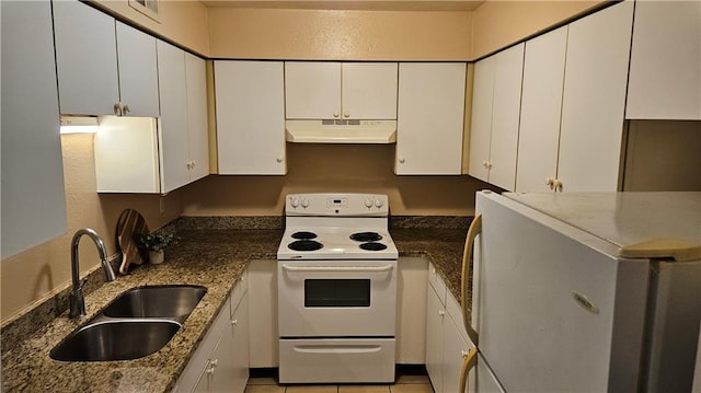 1114 N Dorgenois St, New Orleans, LA 70119 - kitchen featuring white cabinets, white electric range, under cabinet range hood, a sink, and refrigerator