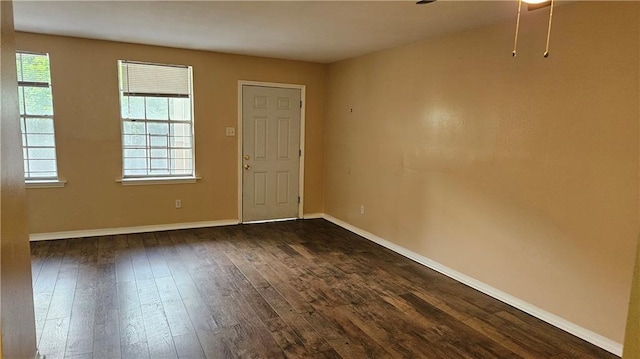 1114 N Dorgenois St, New Orleans, LA 70119 - unfurnished room with ceiling fan, baseboards, and dark wood-style flooring