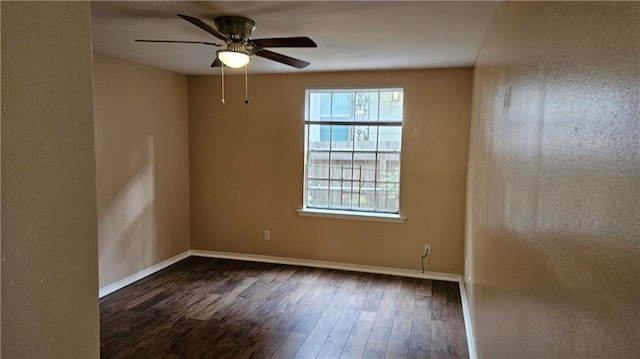 1114 N Dorgenois St, New Orleans, LA 70119 - spare room with ceiling fan, baseboards, and dark wood-style floors