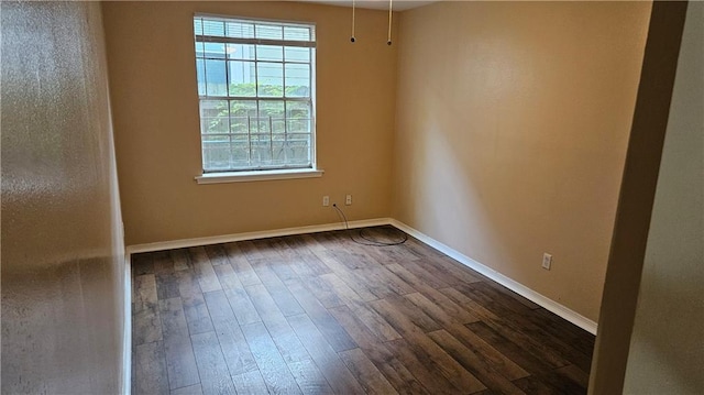 1114 N Dorgenois St, New Orleans, LA 70119 - unfurnished room with dark wood-type flooring and baseboards