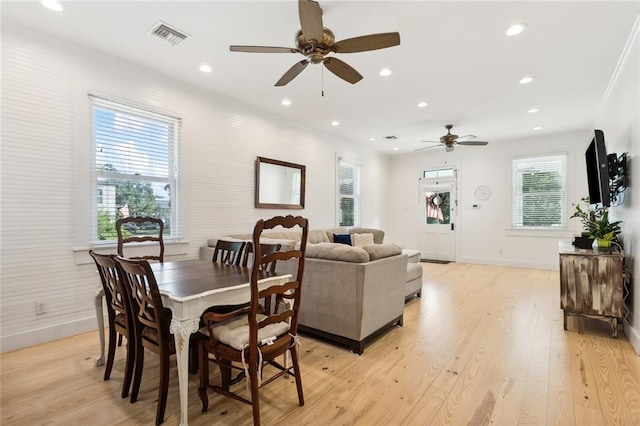 dining room featuring light hardwood / wood-style flooring and ceiling fan