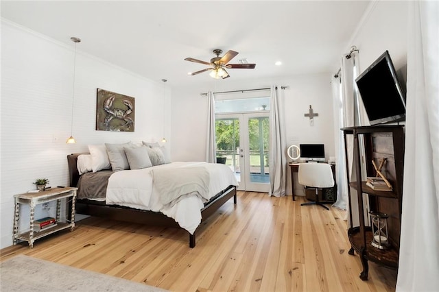 bedroom featuring hardwood / wood-style floors, ceiling fan, access to exterior, crown molding, and french doors