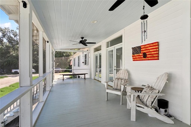 exterior space featuring ceiling fan and a porch