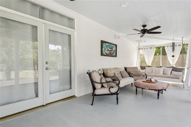 living room featuring hardwood / wood-style flooring and ceiling fan