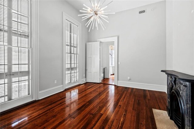 interior space with dark hardwood / wood-style flooring and an inviting chandelier