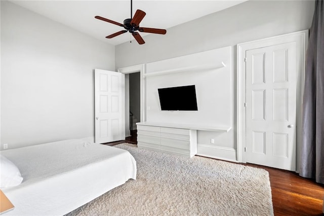 bedroom with dark wood-type flooring and ceiling fan