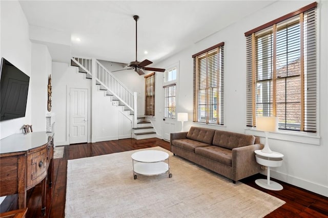 living room featuring ceiling fan, a wealth of natural light, and hardwood / wood-style floors