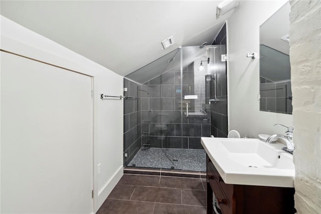 bathroom featuring vanity, an enclosed shower, tile patterned floors, and lofted ceiling