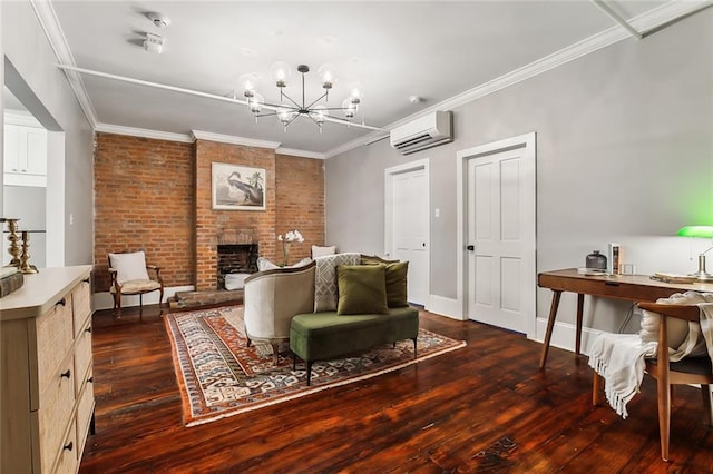 living room featuring a brick fireplace, a wall unit AC, brick wall, an inviting chandelier, and dark hardwood / wood-style floors