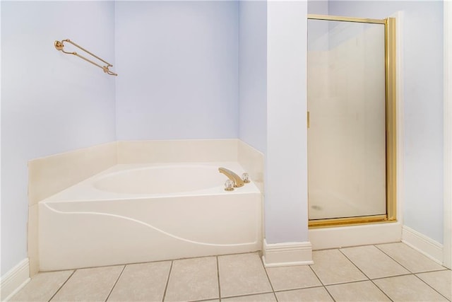 bathroom featuring tile patterned flooring and separate shower and tub