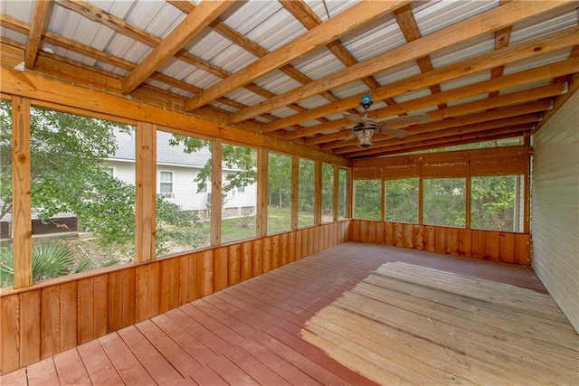 unfurnished sunroom with ceiling fan