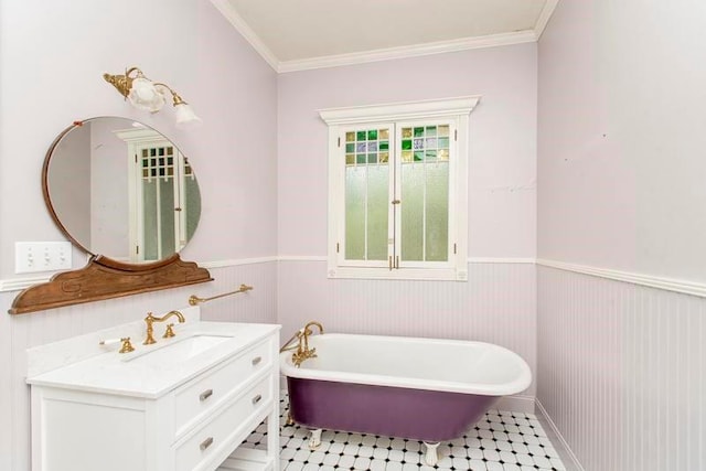 bathroom with vanity, crown molding, tile patterned floors, and a bath