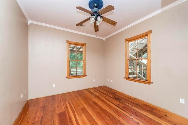 unfurnished room with crown molding, wood-type flooring, and ceiling fan