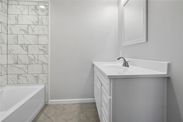 bathroom with vanity, a tub to relax in, and tile patterned floors