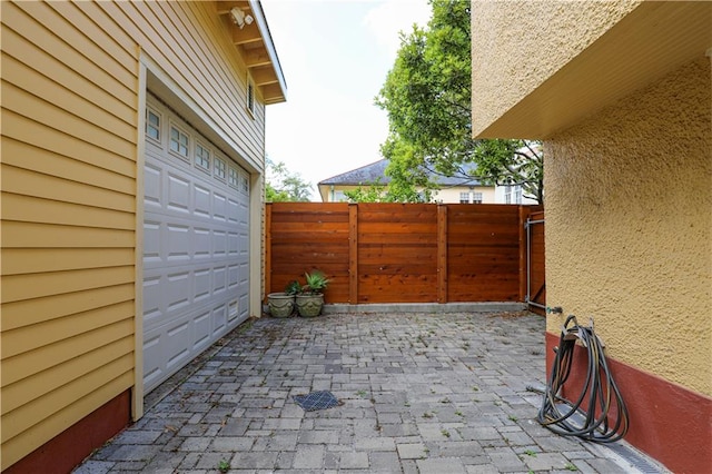 view of patio with a garage