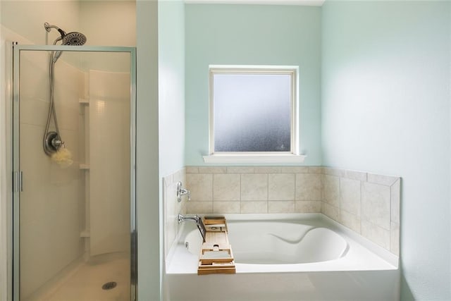 bathroom with shower with separate bathtub