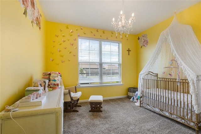 carpeted bedroom featuring an inviting chandelier and a crib