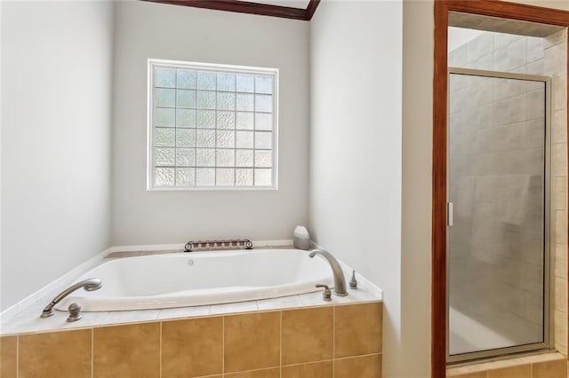 bathroom with separate shower and tub and crown molding