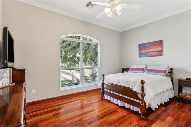 bedroom with ceiling fan, wood-type flooring, and ornamental molding