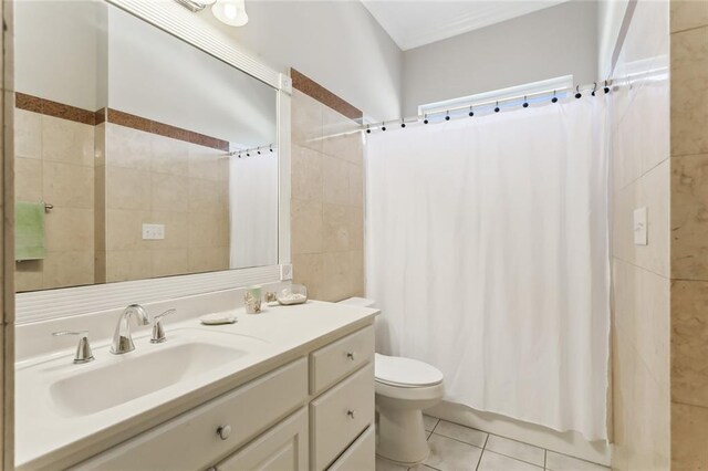 bathroom featuring a shower with curtain, toilet, crown molding, vanity, and tile patterned flooring