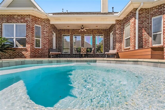 outdoor pool with a ceiling fan
