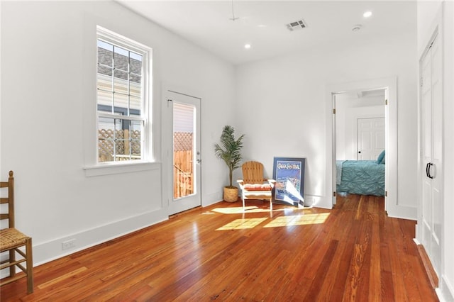 unfurnished room with hardwood / wood-style flooring