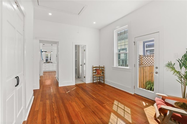 hall with wood-type flooring