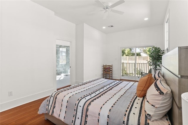 bedroom featuring ceiling fan, hardwood / wood-style flooring, and access to outside